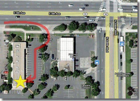 Satellite map showing Gentle Loving Care Dog Grooming at 14480 E. 6th Ave. in Aurora, Colorado, with a red arrow showing the entrance route from East 6th Avenue and a yellow star marking the storefront
